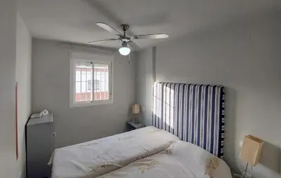a bedroom with a bed and a ceiling fan at Awesome Home In Rota With Wifi in Rota
