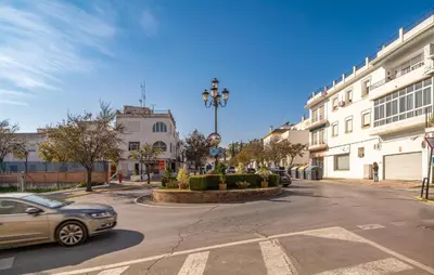 a car driving down a street in a city at Casa Chico in Arcos de la Frontera