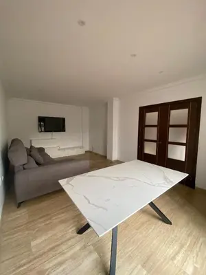 a living room with a couch and a table at JC 7 Chalet in Chiclana de la Frontera