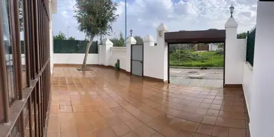 a courtyard of a house with a tile floor at JC 7 Chalet in Chiclana de la Frontera