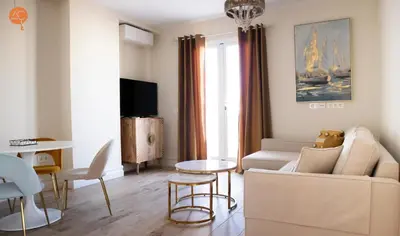 a living room with a couch and a table at Penthouse Plaza San Antonio Grupo AC Gestion in Cádiz
