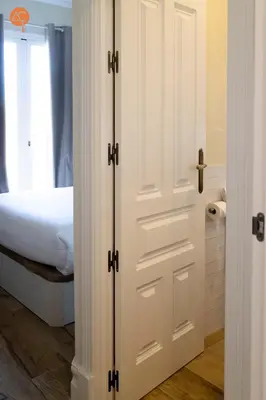 a white door in a bedroom with a bed at Penthouse Plaza San Antonio Grupo AC Gestion in Cádiz