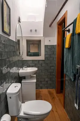 a bathroom with a white toilet and a sink at Casa Del Encanto Arcos in Arcos de la Frontera