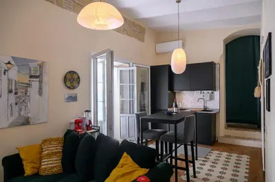 a living room with a couch and a table at Casa Del Encanto Arcos in Arcos de la Frontera