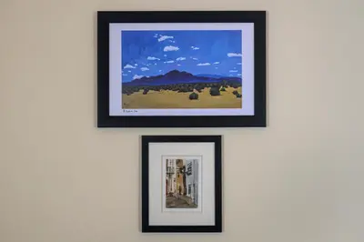 three framed pictures hanging on a wall at Casa Del Encanto Arcos in Arcos de la Frontera