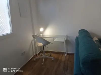 a room with a desk and a couch and a desk and a chair at Apartamento Mar III in San Fernando