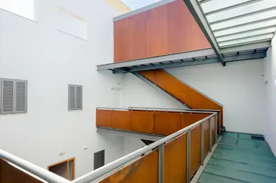 a stairway in a building with wooden panels at Apartamentos Ribera del Puerto in El Puerto de Santa María
