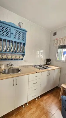 a kitchen with a sink and a counter top at Casa de la Abuela Rosario in Sanlúcar de Barrameda