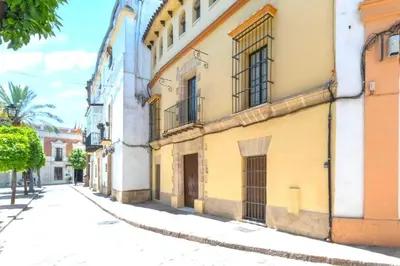 an empty street in a city with buildings at Rincón Centro exclusive in Jerez de la Frontera