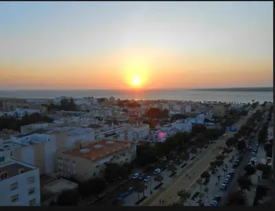an aerial view of a city at sunset at Apartamento en el centro con garaje, terraza, wifi, climatización y piscina in Sanlúcar de Barrameda