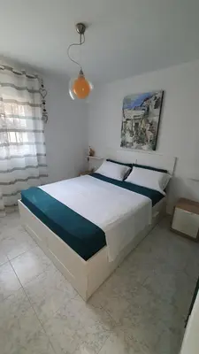 a bedroom with a large bed in a room at La casa bianca in Novo Sancti Petri