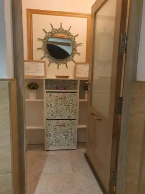 a door leading into a room with a mirror at La casa bianca in Novo Sancti Petri