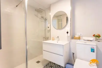 a bathroom with a shower and a toilet and a sink at Retama Golf by Cadiz Time in Novo Sancti Petri