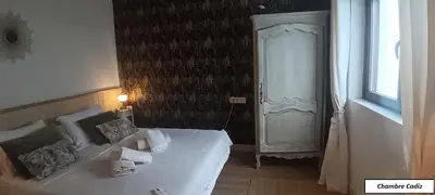a bedroom with a white bed and a window at Oasis de Bornos Maison Entière in Bornos