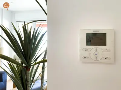 a lightswitch on a wall next to a plant at Miramar Grupo AC Gestion in Cádiz