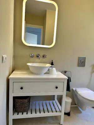 a bathroom with a sink and a mirror at Casa singular completamente reformada in El Puerto de Santa María