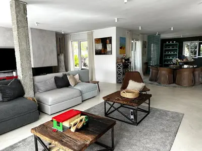 a living room with a couch and a table at Casa singular completamente reformada in El Puerto de Santa María