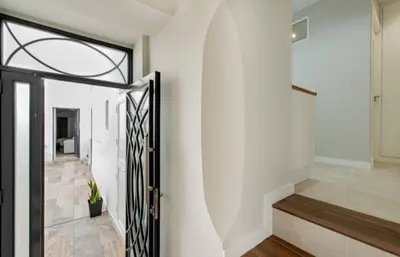 a hallway with a door leading to a stairway at Loft Casa del Duque in Arcos de la Frontera