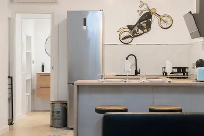 a kitchen with a motorcycle hanging on the wall at Falla Loft & Beach in Cádiz