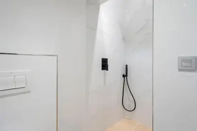 a bathroom with a shower with a glass door at Falla Loft & Beach in Cádiz