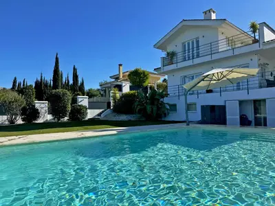 a large swimming pool in front of a house at Villa Montecastillo - Ole Solutions in Jerez de la Frontera