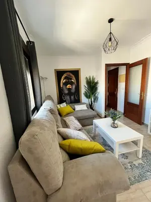 a living room with a couch and a table at Cruces in El Puerto de Santa María