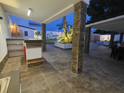 a living room with a fireplace in a house at La caprichosa in Chiclana de la Frontera