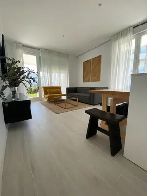a living room with a couch and a coffee table at Rinconcito en el Paraíso Costa Ballena in Costa Ballena