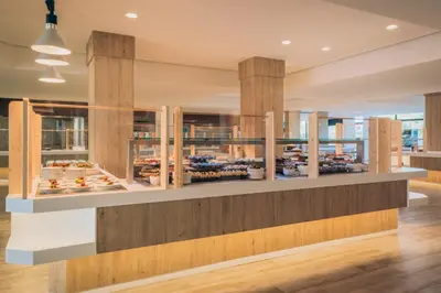 a bakery with a display case of pastries at Iberostar Waves Royal Andalus in Chiclana de la Frontera