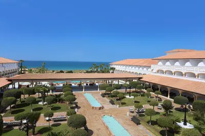 an aerial view of the resort with the ocean in the background at Iberostar Selection Andalucia Playa in Chiclana de la Frontera