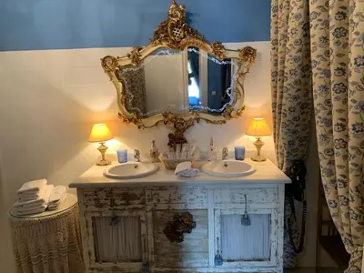 a bathroom with a sink and a mirror at Casa Palacio Jerezana in Jerez de la Frontera