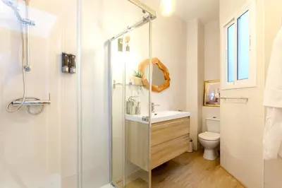 a bathroom with a shower and a sink and a toilet at precioso piso en playa caleta in Cádiz