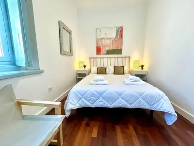 a bedroom with a bed with two towels on it at El Palacito 