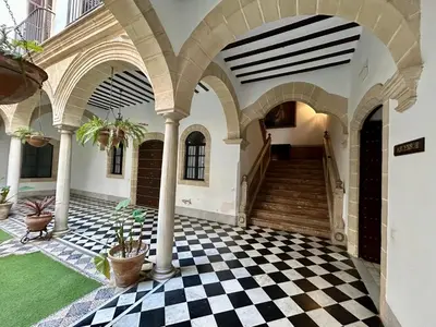 a courtyard with a checkered floor in a building at El Palacito 