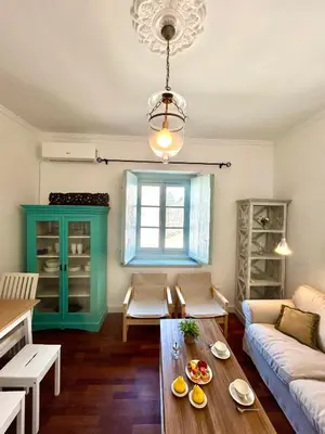 a living room with a couch and a table at El Palacito 