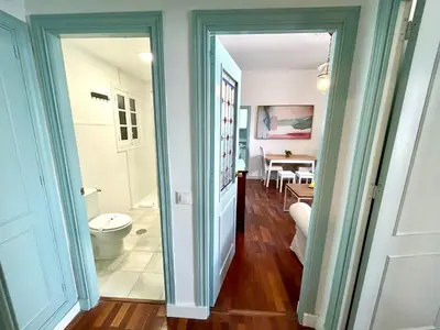 a bathroom with a toilet and a dining room at El Palacito 
