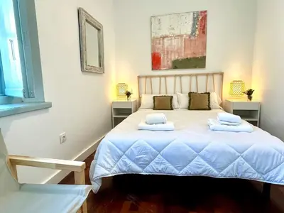 a bedroom with a bed with two pillows on it at El Palacito 