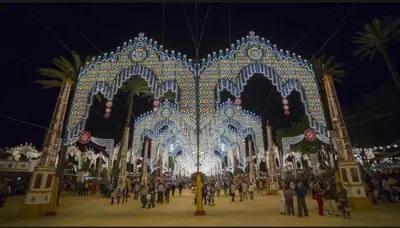 a group of people standing in front of a structure with lights at Casa Alzar in Jerez de la Frontera