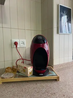 a red blender sitting on a tray on a counter at Casa Alzar in Jerez de la Frontera