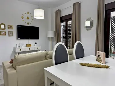a living room with a couch and a table at Apartamento La Frontera - Ole Solutions in Jerez de la Frontera