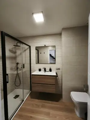 a bathroom with a sink and a shower and a toilet at Recidencial Cruz del Mar 