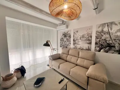 a living room with a couch and a table at Victoria Centro 34 in Puerto Real
