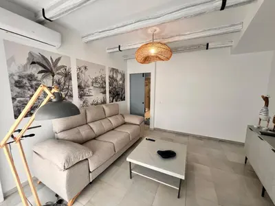 a living room with a couch and a table at Victoria Centro 34 in Puerto Real