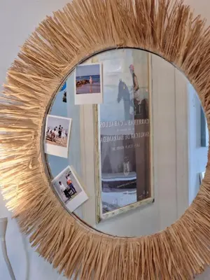 a mirror on a wall with photos in it at Next to piletas 67 Sanlucar de Barrameda in Sanlúcar de Barrameda