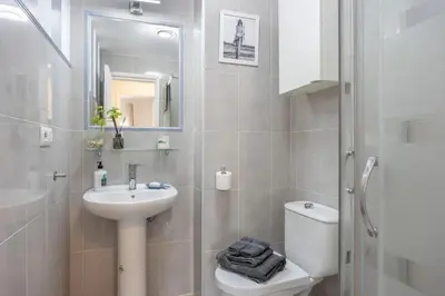 a bathroom with a sink and a toilet and a shower at Next to piletas 67 Sanlucar de Barrameda in Sanlúcar de Barrameda