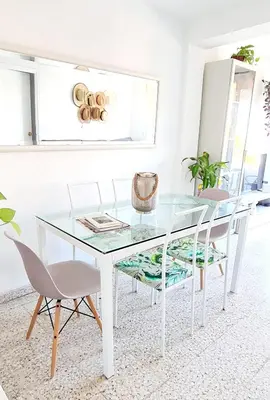 a glass table and chairs in a living room at Next to piletas 67 Sanlucar de Barrameda in Sanlúcar de Barrameda