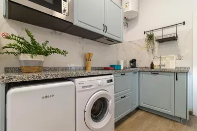 a laundry room with a washer and dryer at Apartamento Santa Clara 3 in Jerez de la Frontera