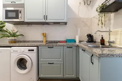 a kitchen with a washing machine and a sink at Apartamento Santa Clara 3 in Jerez de la Frontera