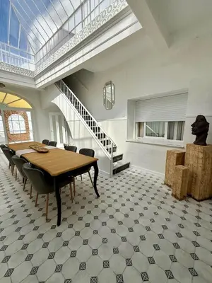 a dining room with a table and chairs at Villa Palacio con Piscina Privada in Puerto Real