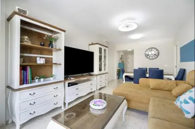 a living room with a couch and a tv at Agua Marina by Staycare in Rota